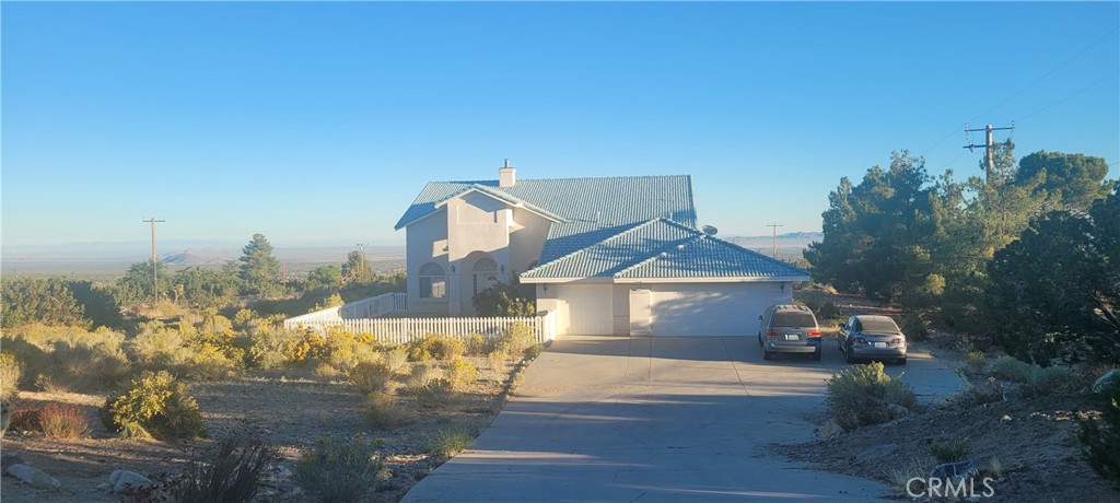 1426 Tamarack Road Pinon Hills, CA 92372 - Photo 1 of 1 a front view of a house with a yard