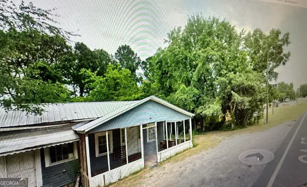 a house with trees in the background