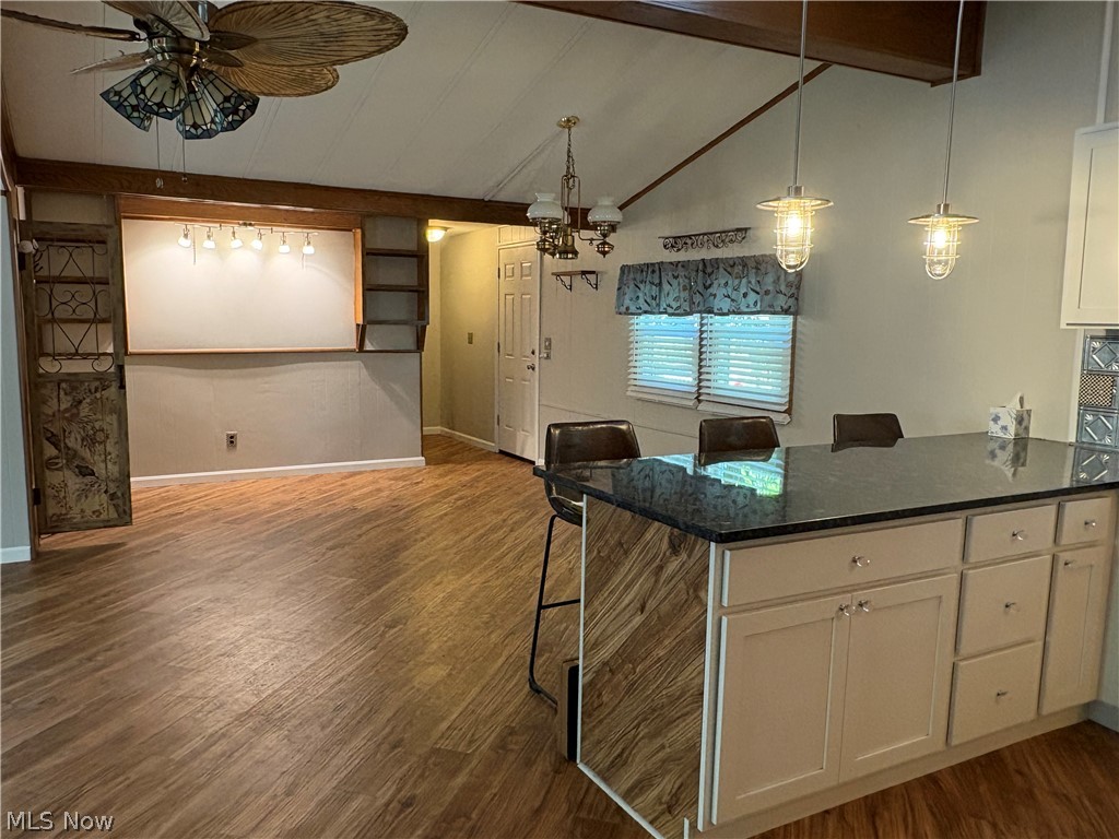 8701 Mayfield Road, Unit 148 Chesterland, OH 44026 - Photo 4 of 22 Kitchen island featuring a granite countertop. New flooring throughout.