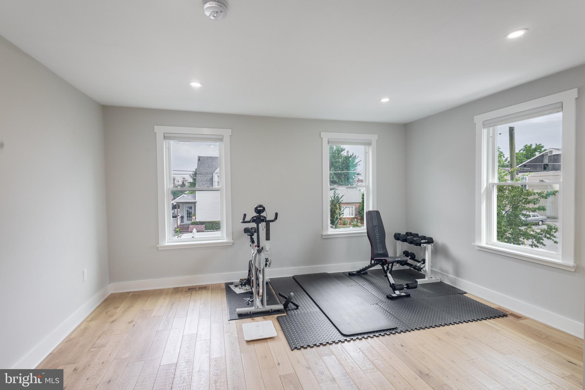 37 4th Street Laurel, MD 20707 - Photo 11 of 26 a view of a room with gym equipment and a window
