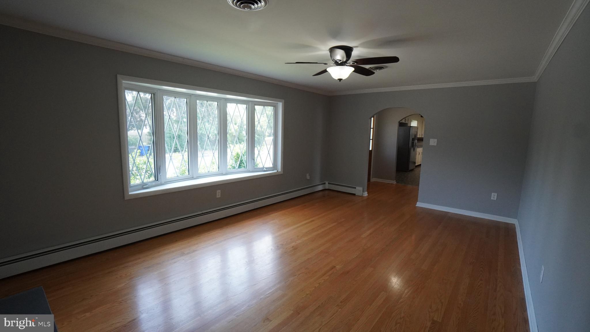 367 Devonshire Road Hagerstown, MD 21740 - Photo 12 of 35 a view of an empty room with glass door and wooden floor