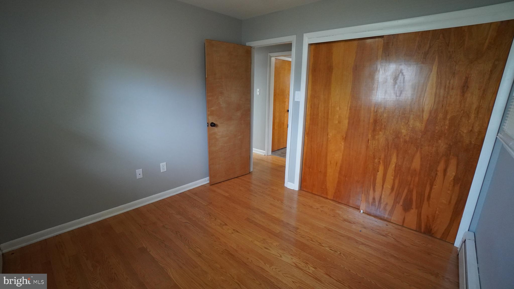 367 Devonshire Road Hagerstown, MD 21740 - Photo 16 of 35 a view of an empty room with wooden floor and a window
