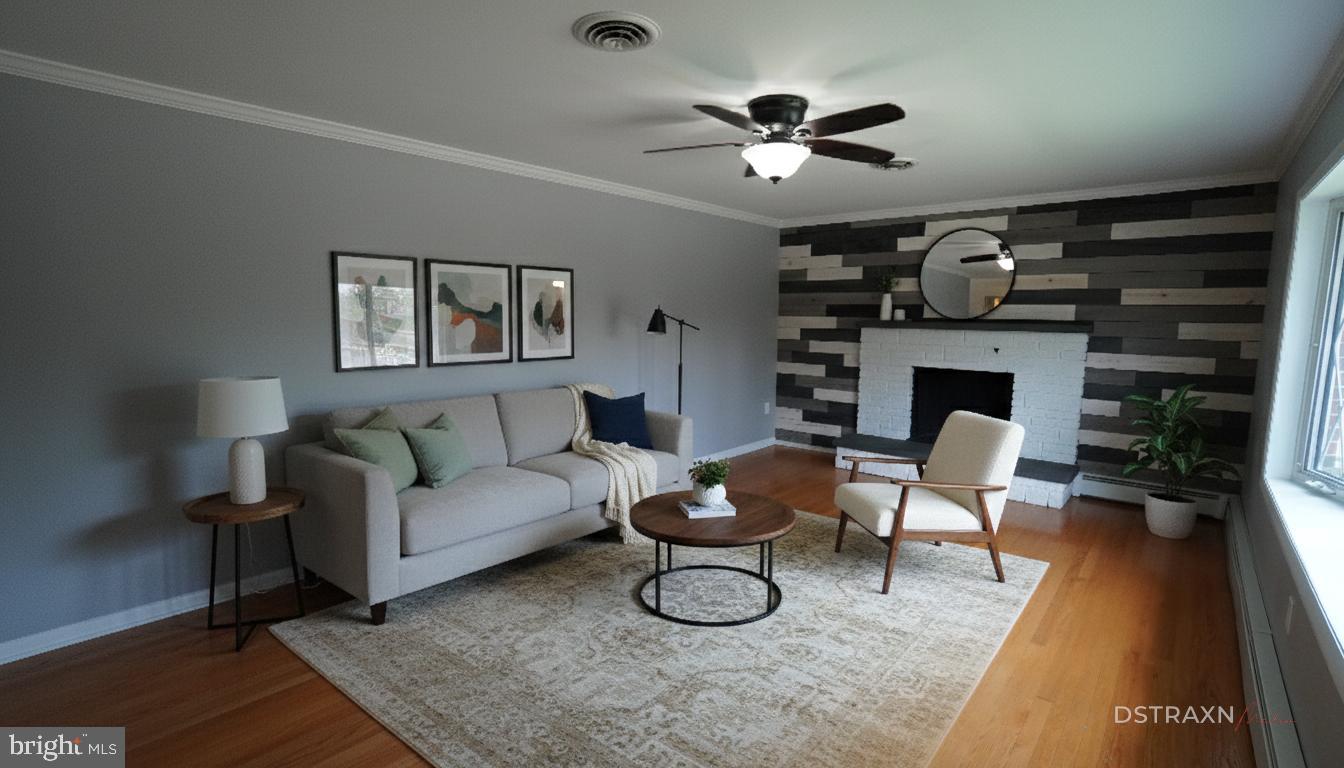 367 Devonshire Road Hagerstown, MD 21740 - Photo 2 of 35 a living room with furniture a ceiling fan and a fireplace