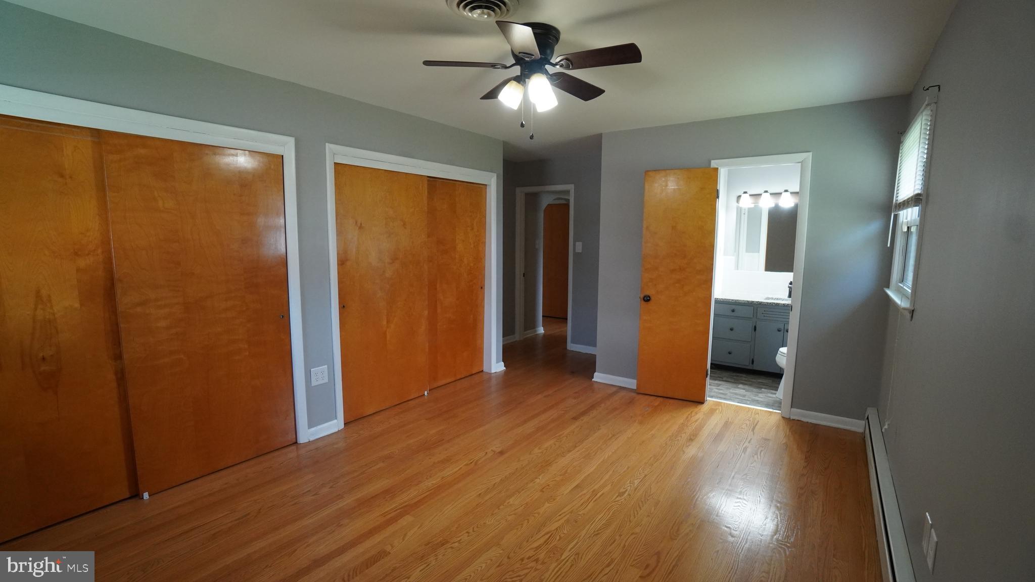 367 Devonshire Road Hagerstown, MD 21740 - Photo 21 of 35 wooden floor in an empty room with a window