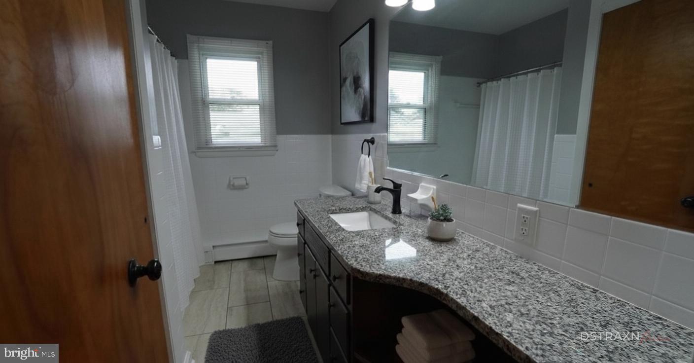 367 Devonshire Road Hagerstown, MD 21740 - Photo 7 of 35 a bathroom with sinks granite and a mirror