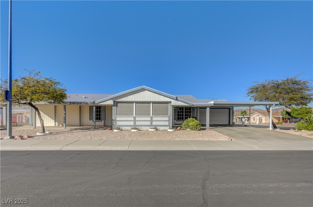 2011 Darla Street Henderson, NV 89002 - Photo 2 of 44 View of front of house featuring concrete driveway, an attached garage, and a carport