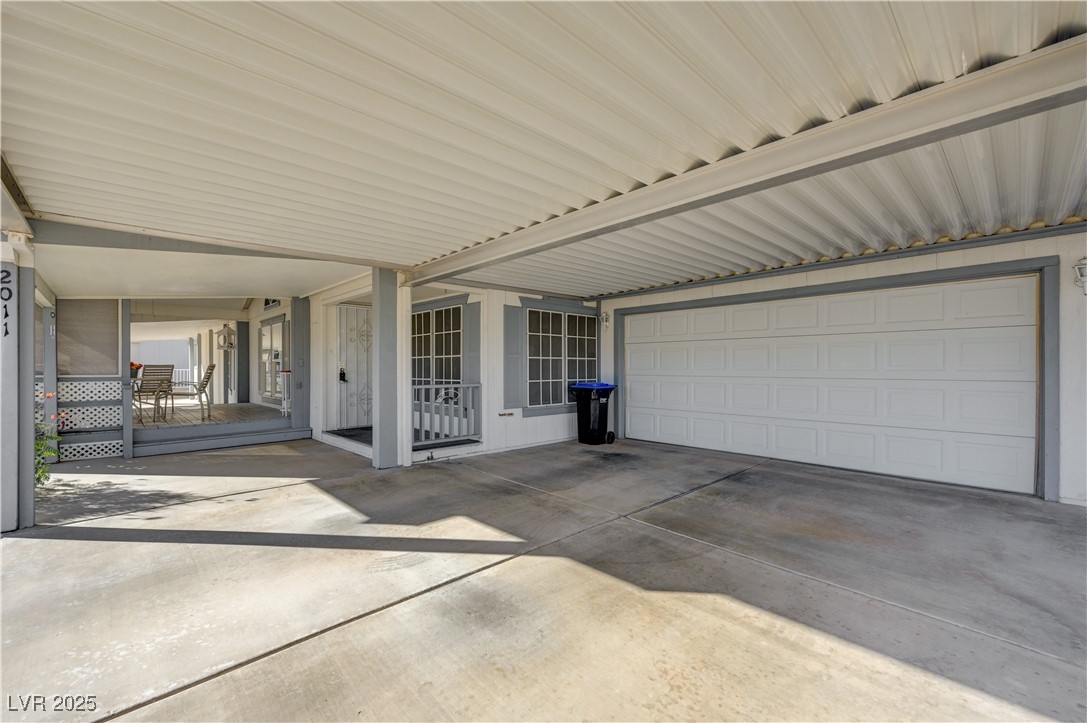 2011 Darla Street Henderson, NV 89002 - Photo 3 of 44 View of patio featuring a garage and driveway