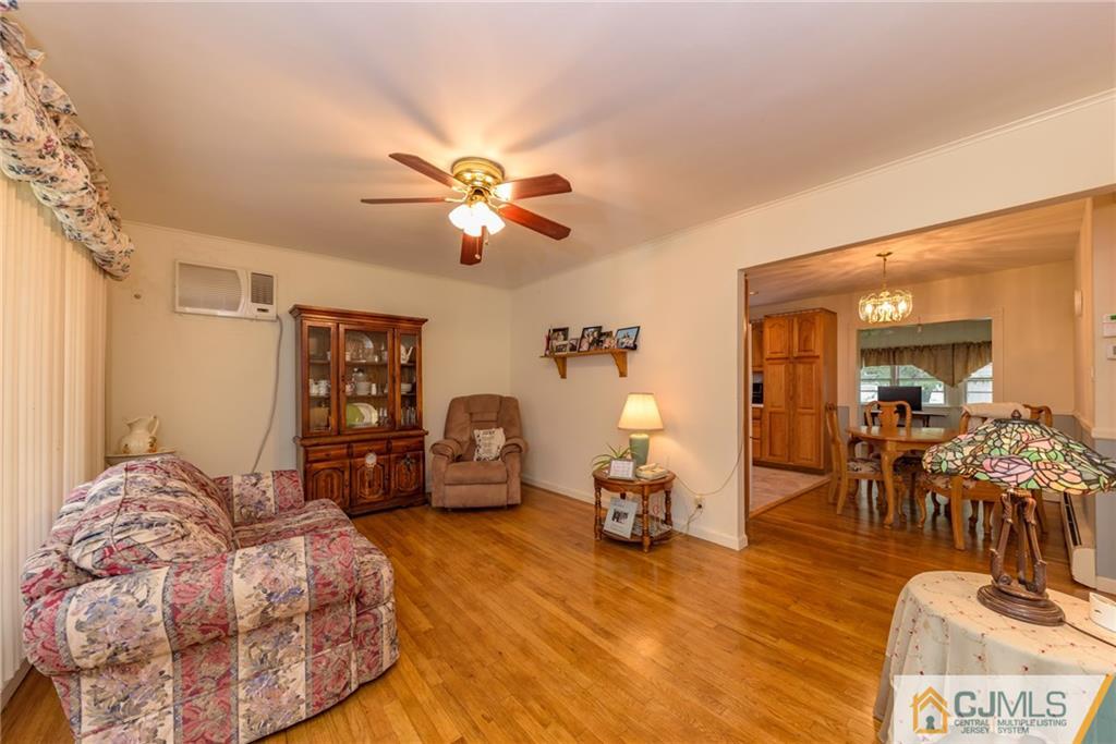 54 Phyllis Road West Orange, NJ 07052 - Photo 3 of 25 a living room with furniture and wooden floor