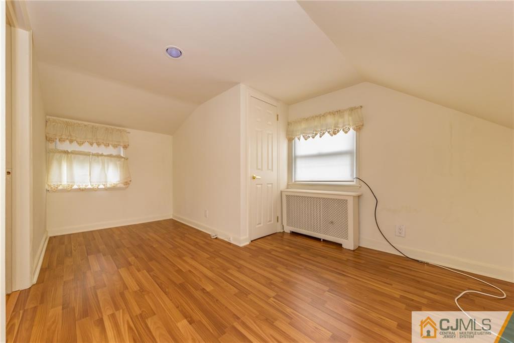 54 Phyllis Road West Orange, NJ 07052 - Photo 22 of 25 a view of empty room with wooden floor and fan
