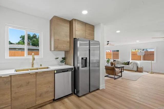 a kitchen with a refrigerator and a sink