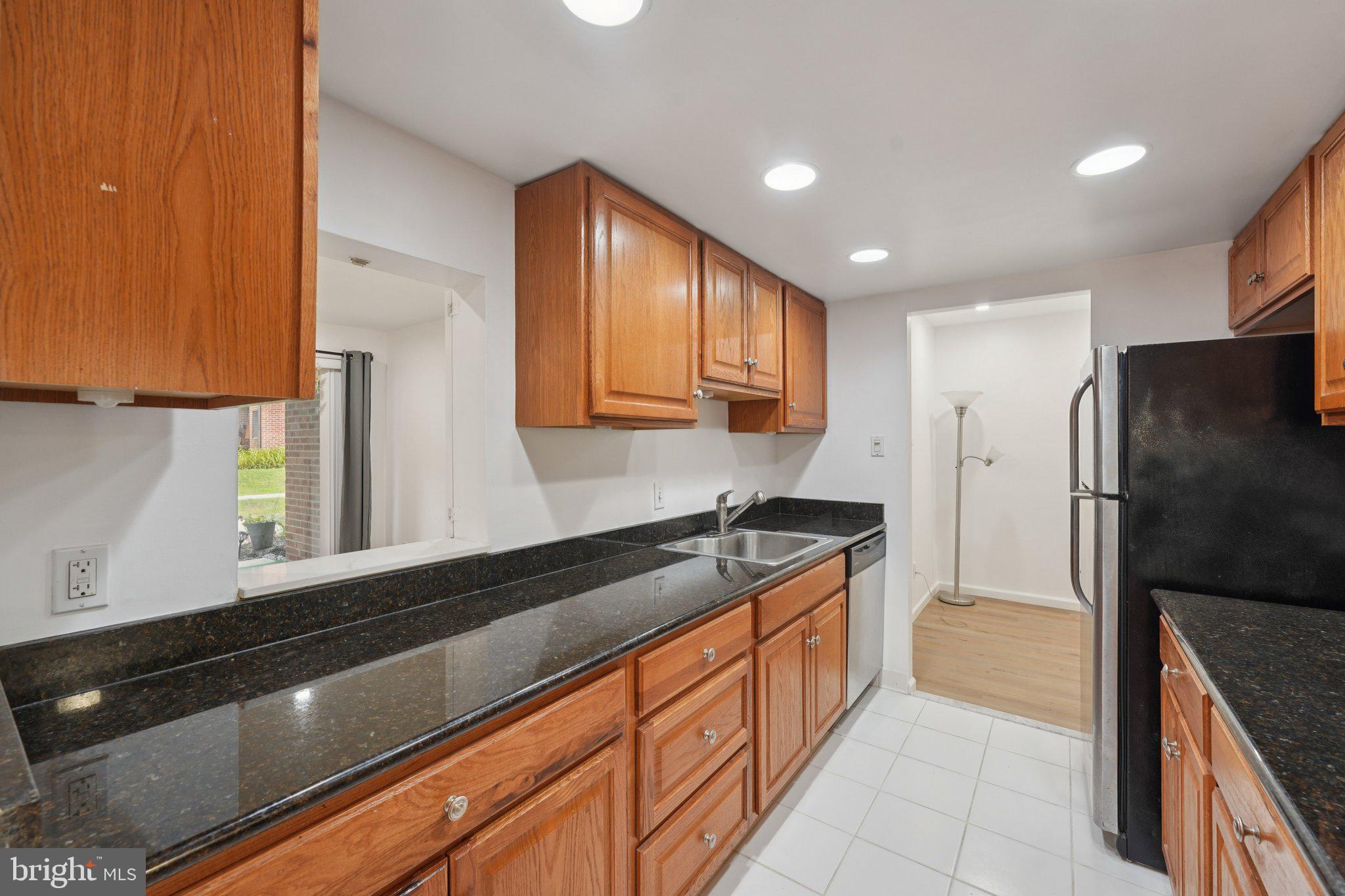 272 Drummers Lane Wayne, PA 19087 - Photo 13 of 46 a kitchen with stainless steel appliances granite countertop a refrigerator and a sink