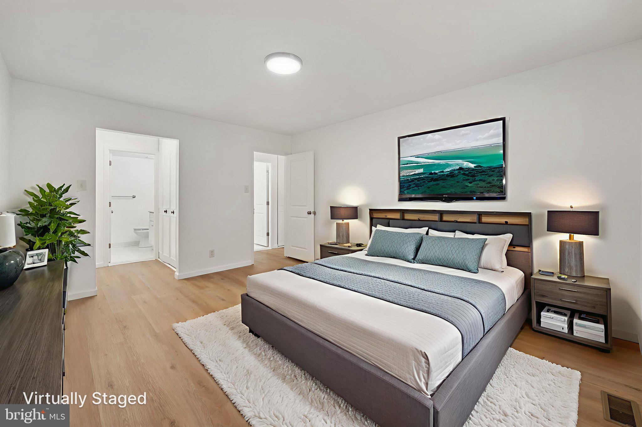 272 Drummers Lane Wayne, PA 19087 - Photo 18 of 46 a spacious bedroom with a bed and a couch