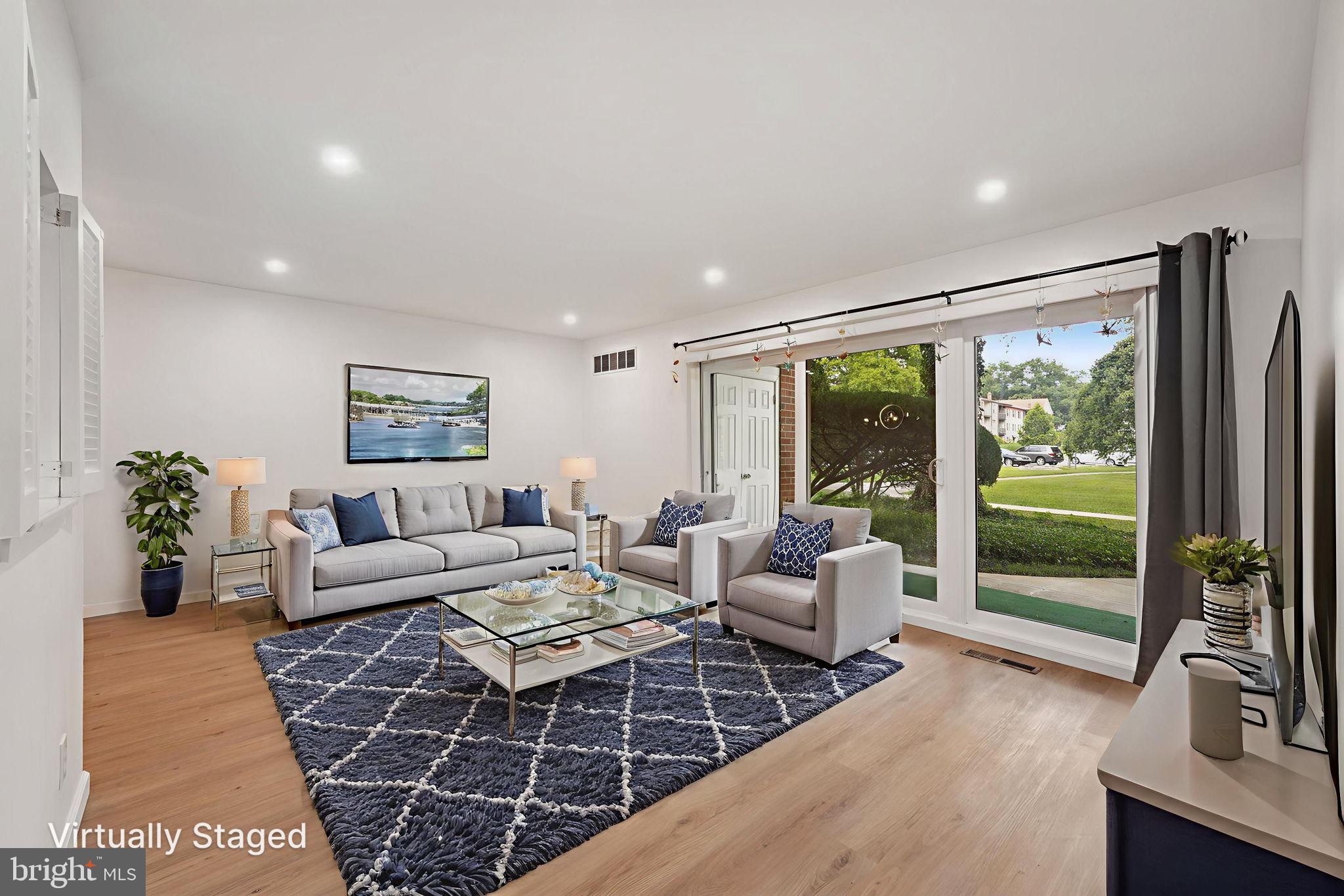 272 Drummers Lane Wayne, PA 19087 - Photo 7 of 46 a living room with furniture and a floor to ceiling window