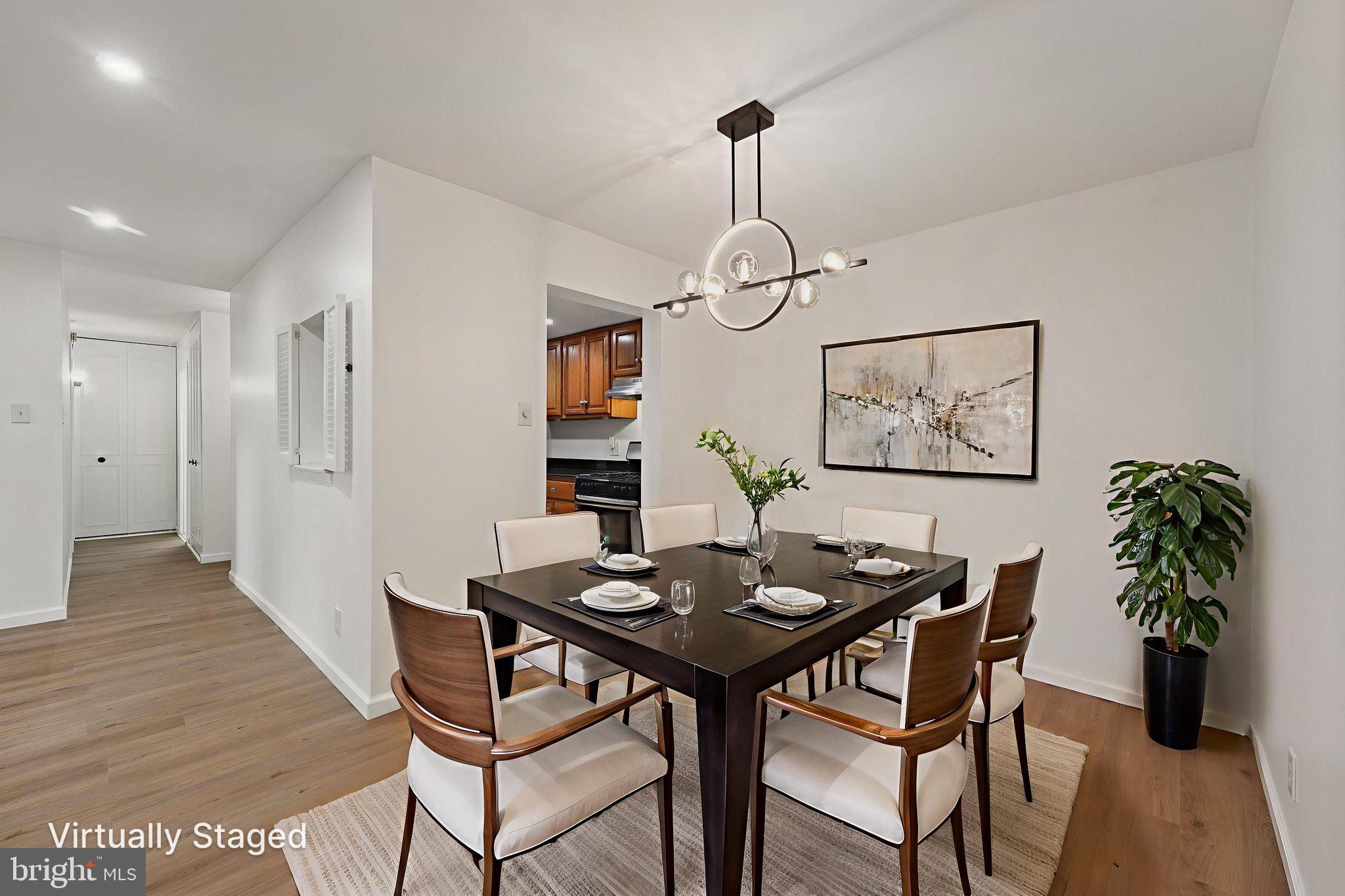 272 Drummers Lane Wayne, PA 19087 - Photo 9 of 46 a view of a dining room with furniture wooden floor and chandelier