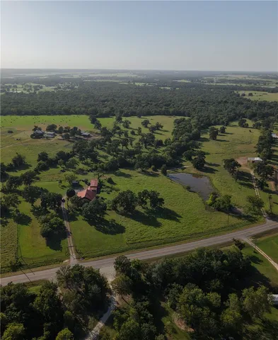 an aerial view of residential house with outdoor space and river view