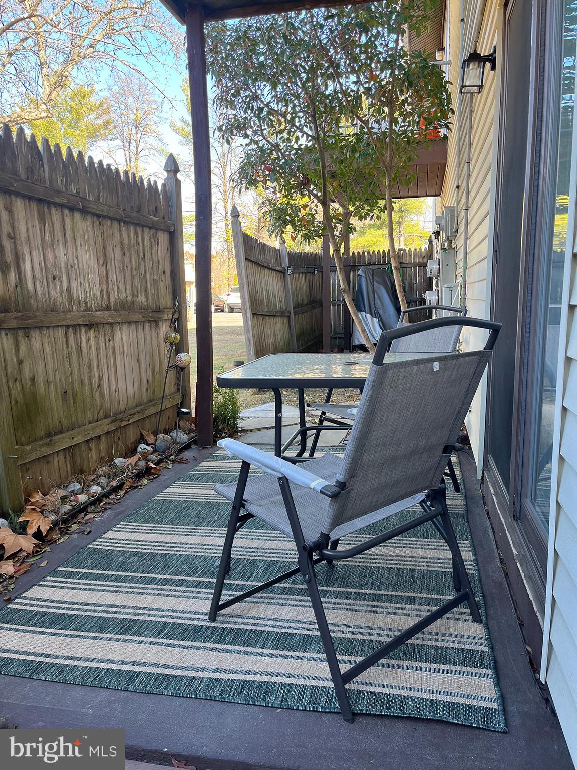 40 Tansboro Road, Unit 3A Berlin, NJ 08009 - Photo 16 of 19 a view of backyard with a table and chairs