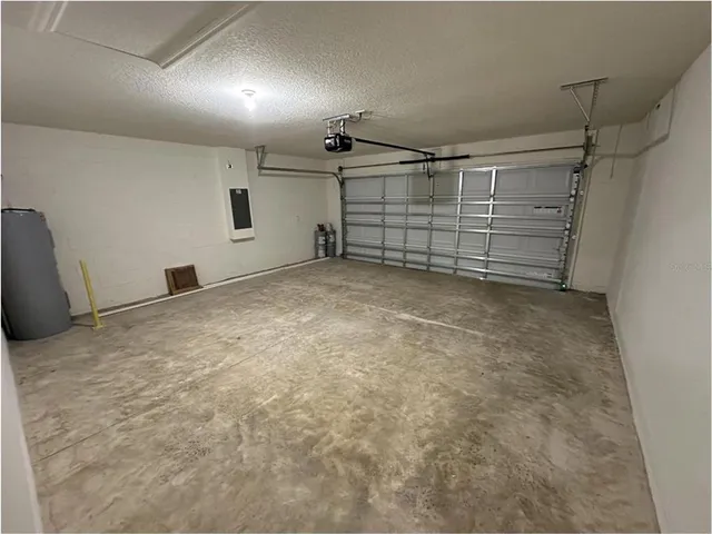 a front view of a house with yard and trees