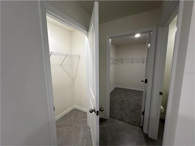 a bathroom with a double vanity sink and mirror