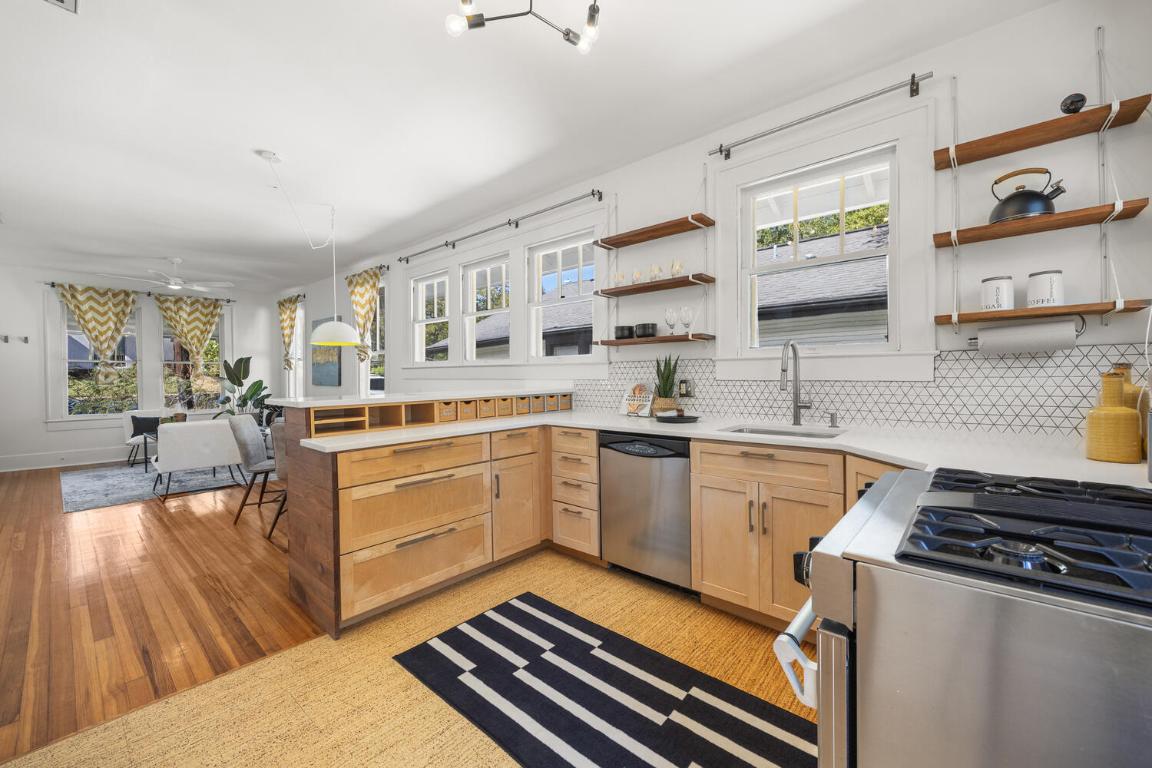 711 Patterson Avenue Austin, TX 78703 - Photo 12 of 21 a kitchen with a sink stove and cabinets