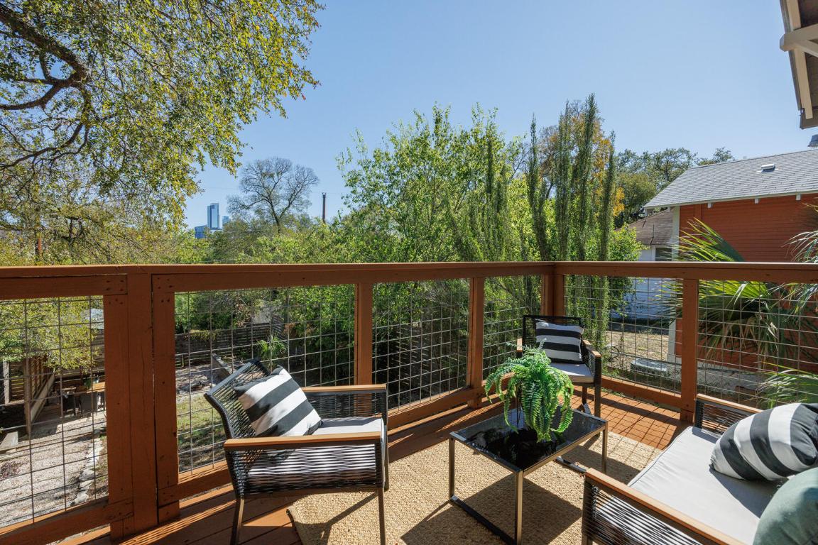 711 Patterson Avenue Austin, TX 78703 - Photo 14 of 21 a view of a couches in the deck under a large tree