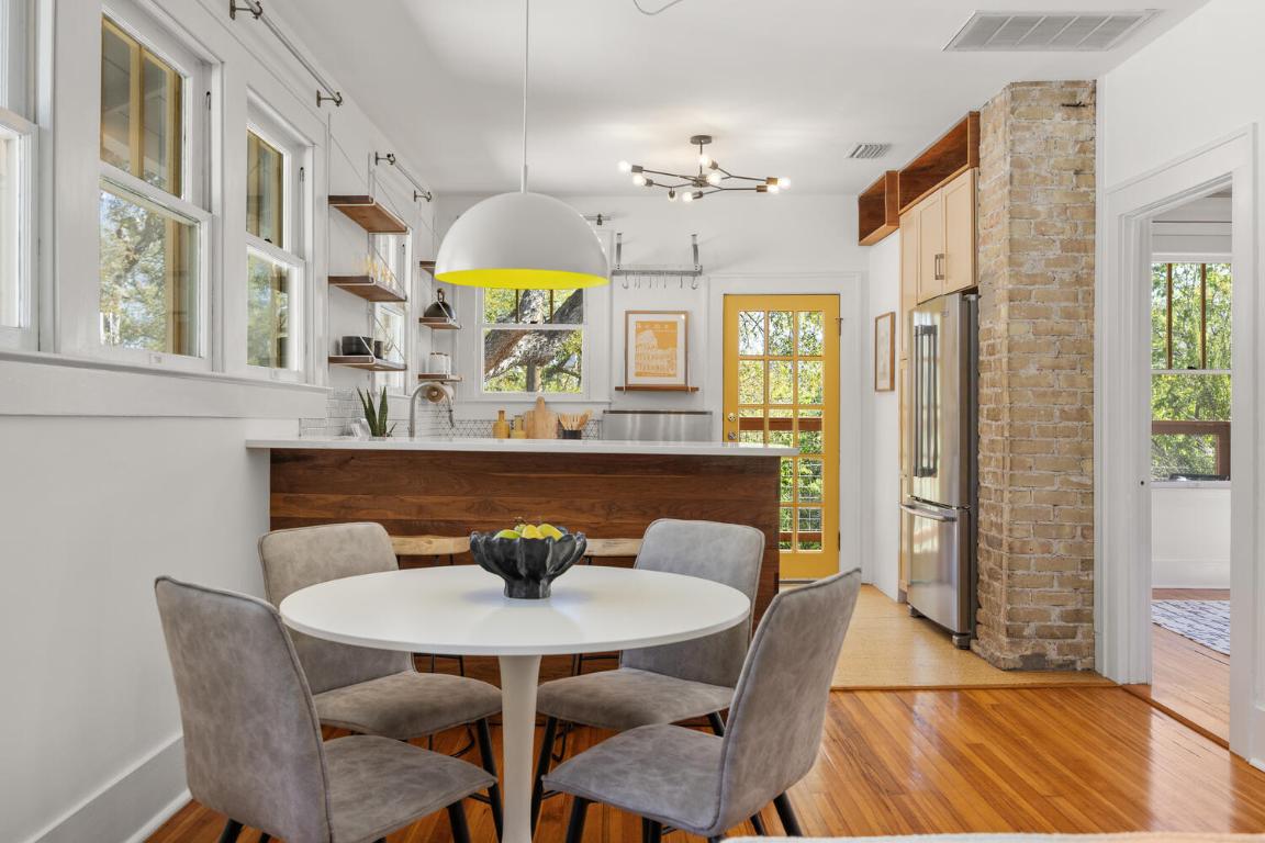 711 Patterson Avenue Austin, TX 78703 - Photo 10 of 21 a view of a dining room with furniture and a chandelier