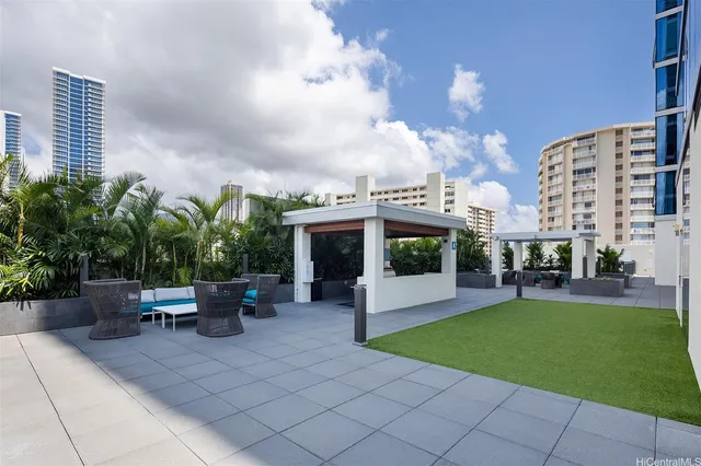 a view of a patio with couches and potted plants