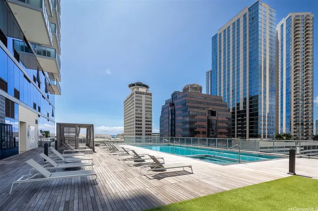 a view of a patio with a table and chairs and potted plants