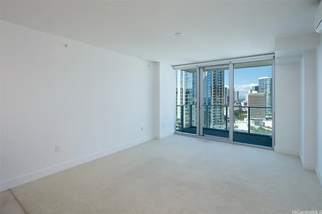 an empty room with floor to ceiling window