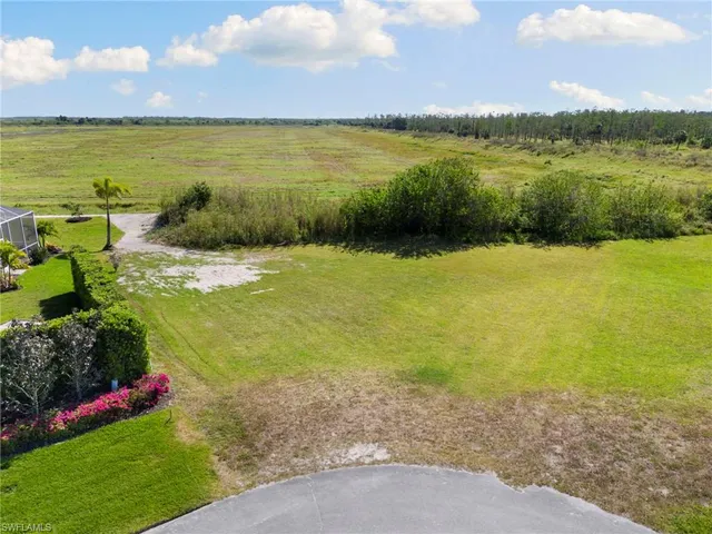 a view of a lake with a yard