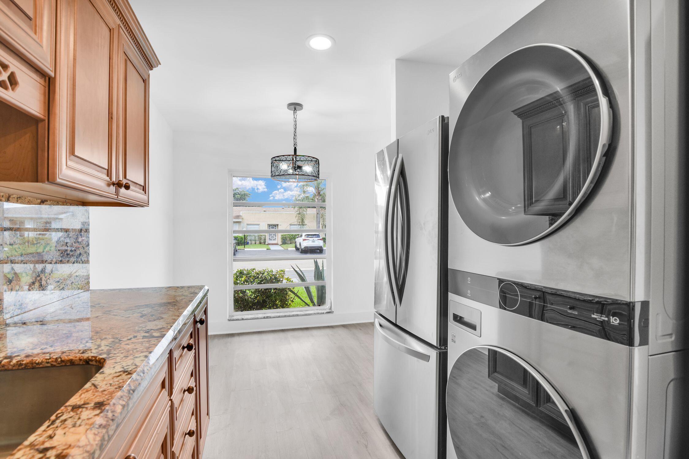 8807 Bella Vista Drive, Unit 280 Boca Raton, FL 33433 - Photo 10 of 44 view of kitchen with washer and dryer