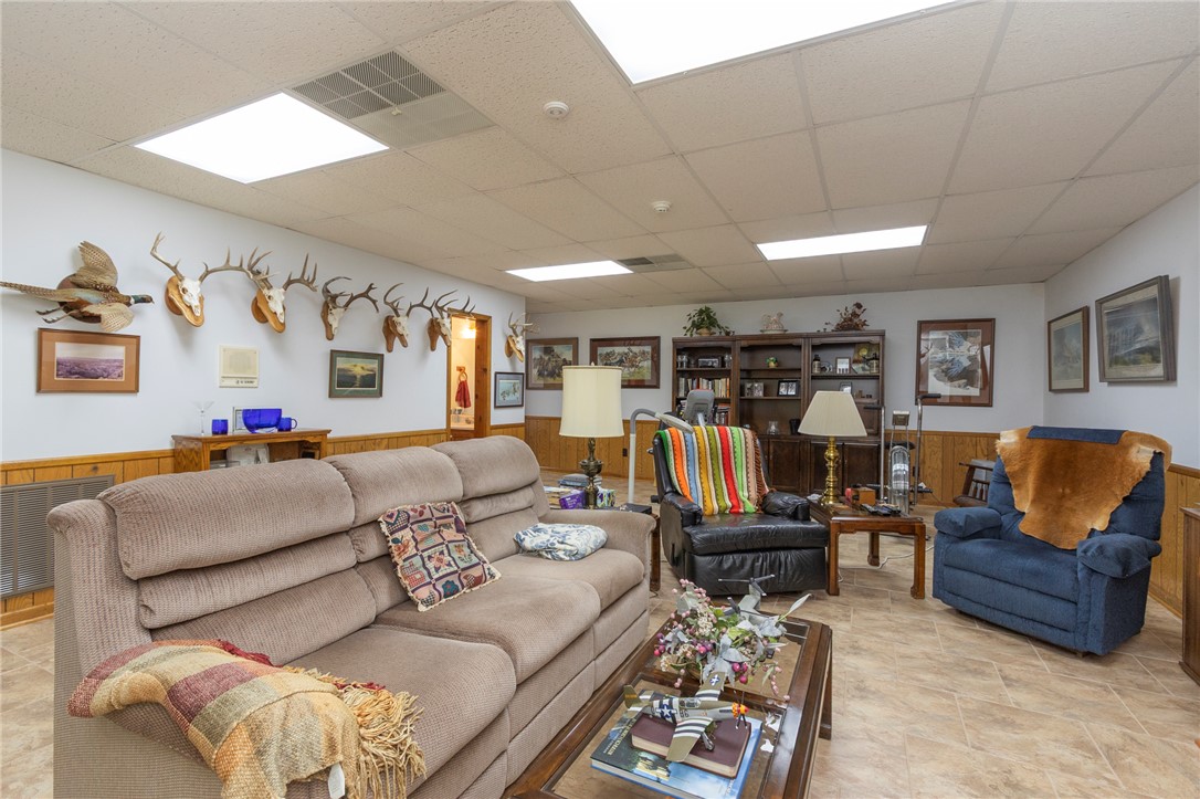 202 Plantation Point Anderson, SC 29625 - Photo 35 of 48 A versatile living area with wood paneling offers ample space for relaxation and entertainment.