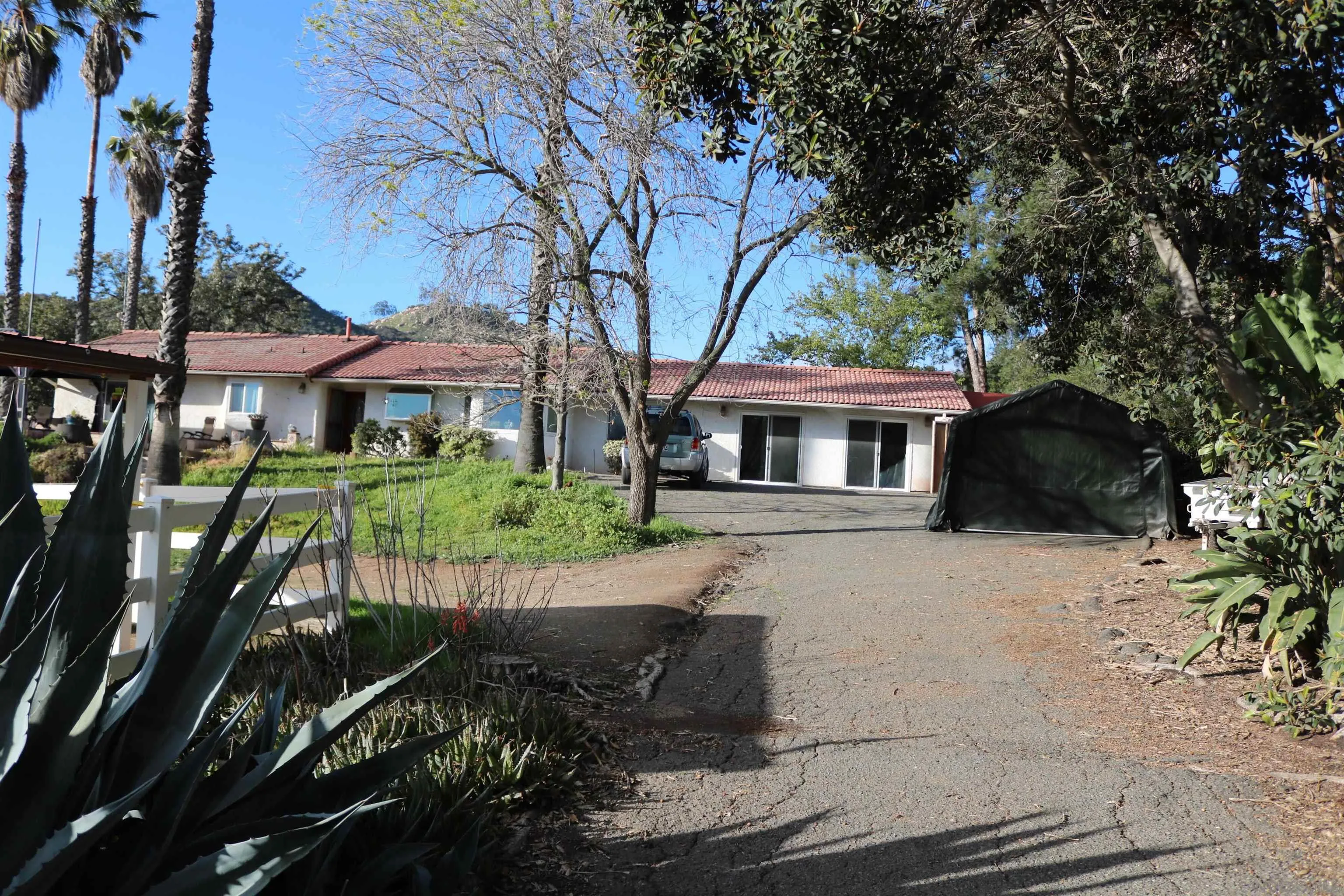 38083 De Luz Road Fallbrook, CA 92028 - Photo 2 of 29 a front view of a house with a yard