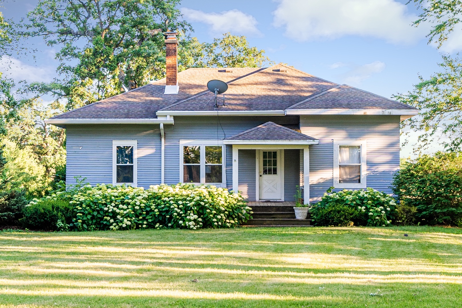 18715 West Edwards Road Antioch, IL 60002 - Photo 58 of 66 a front view of a house with a garden
