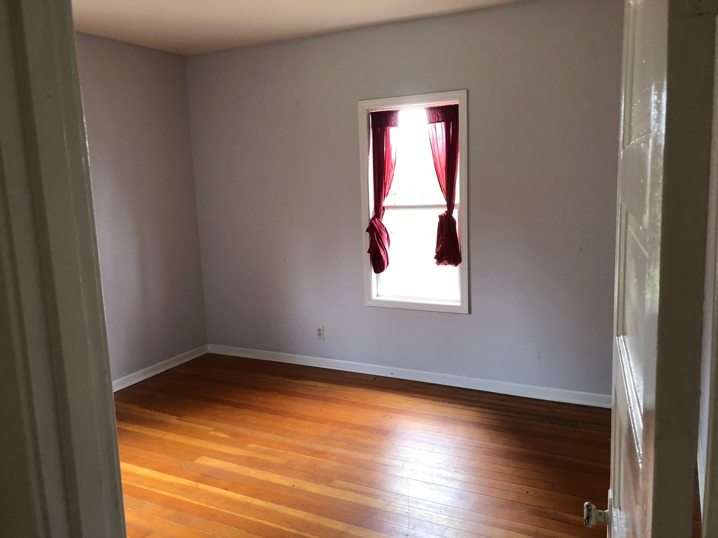 18715 West Edwards Road Antioch, IL 60002 - Photo 64 of 66 an empty room with wooden floor and windows
