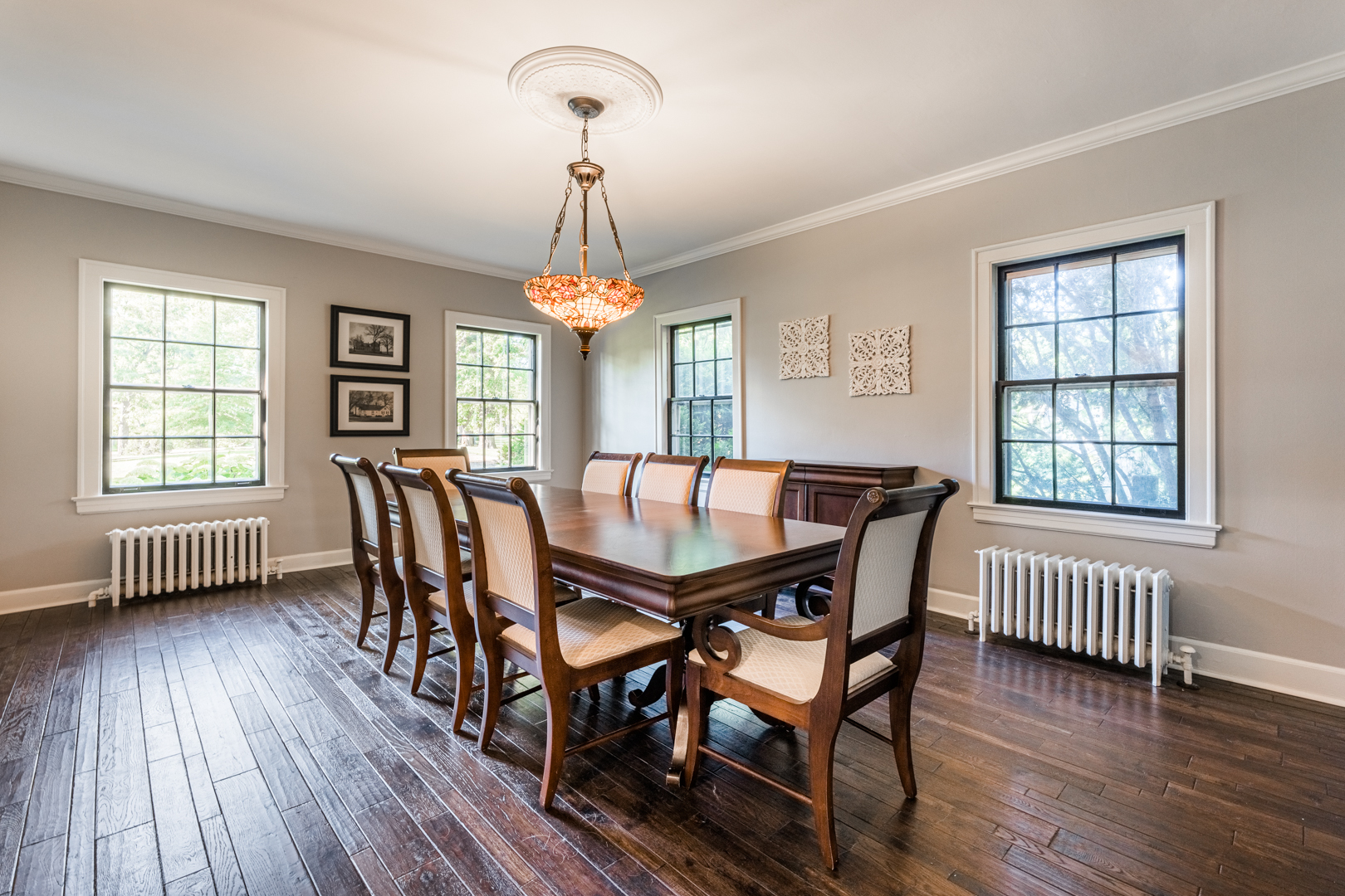 18715 West Edwards Road Antioch, IL 60002 - Photo 9 of 66 a view of a dining room with furniture a chandelier and wooden floor