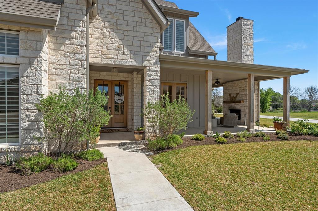 216 Wycliff Drive China Spring, TX 76633 - Photo 5 of 40 a front view of a house with garden