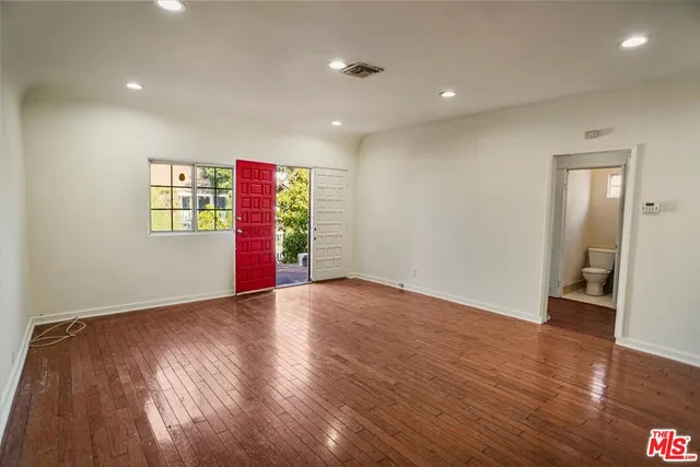 a view of an empty room and window