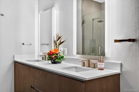 a bathroom with a sink vanity and a mirror