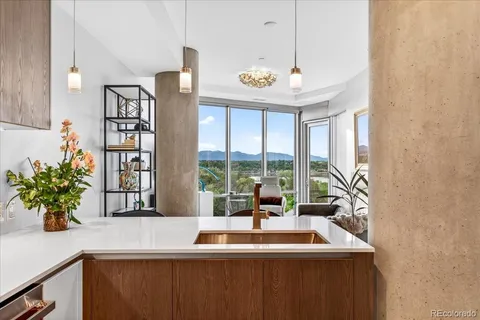 a dining table with chairs and window