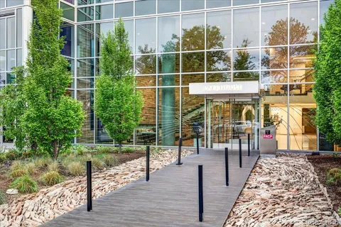a view of a wooden deck with a yard