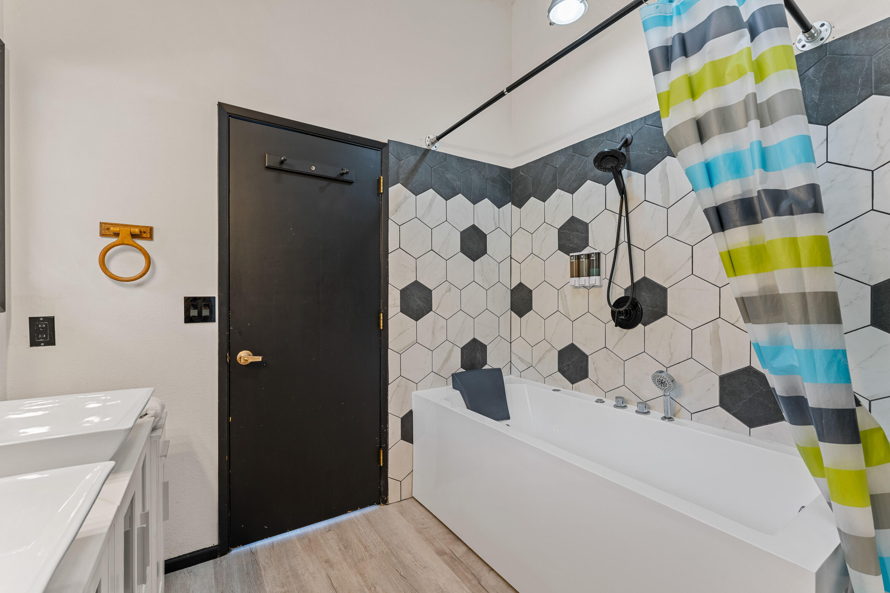 7201 Crowfoot Road Trail, OR 97541 - Photo 25 of 56 a bathroom with a sink and a shower curtain