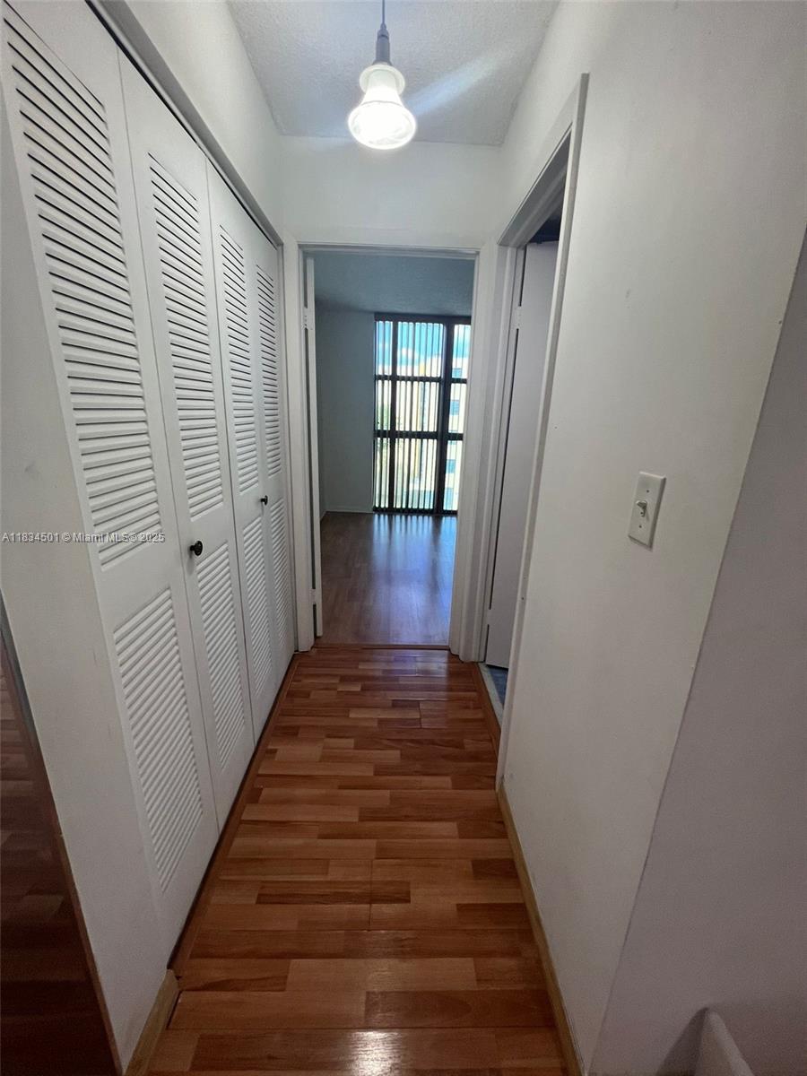 International Park Miami, FL 33175 - Photo 13 of 26 a view of a hallway view with wooden floor and staircase