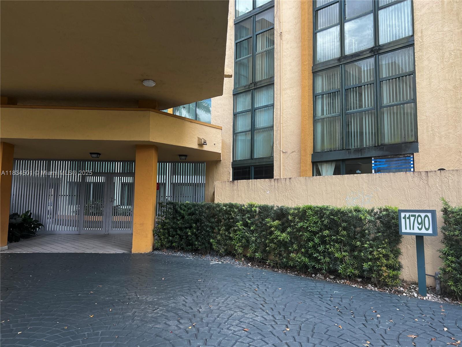 International Park Miami, FL 33175 - Photo 25 of 26 front view of a brick house with a small yard