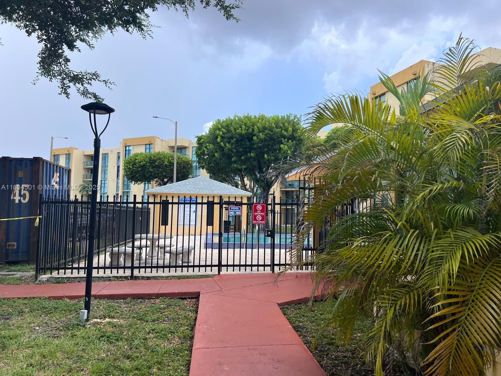 International Park Miami, FL 33175 - Photo 26 of 26 a view of a backyard with a palm tree