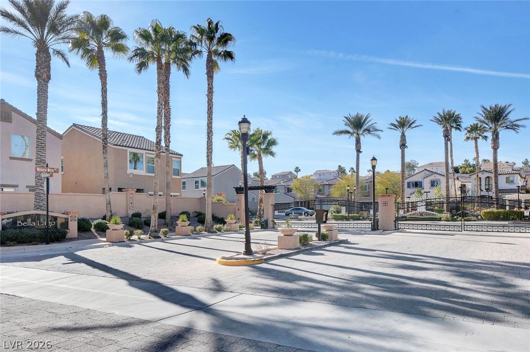 48 Jasmine Point Street Henderson, NV 89074 - Photo 10 of 62 Palm-lined streets greet residents at the gated entry of this appealing community.