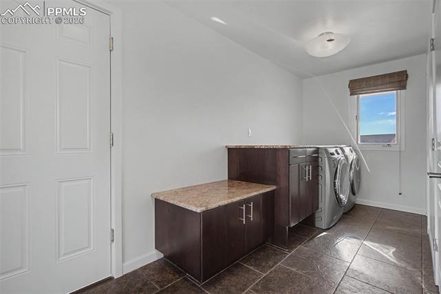 733 Bowstring Road Monument, CO 80132 - Photo 35 of 45 Spacious mudroom with walk-out to front porch and door to garage