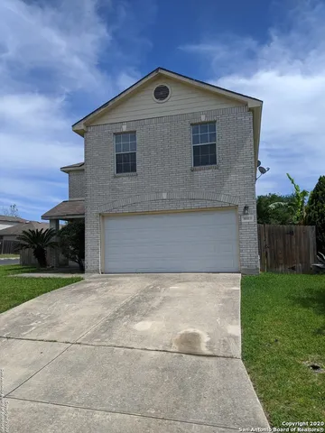 a front view of a house with yard