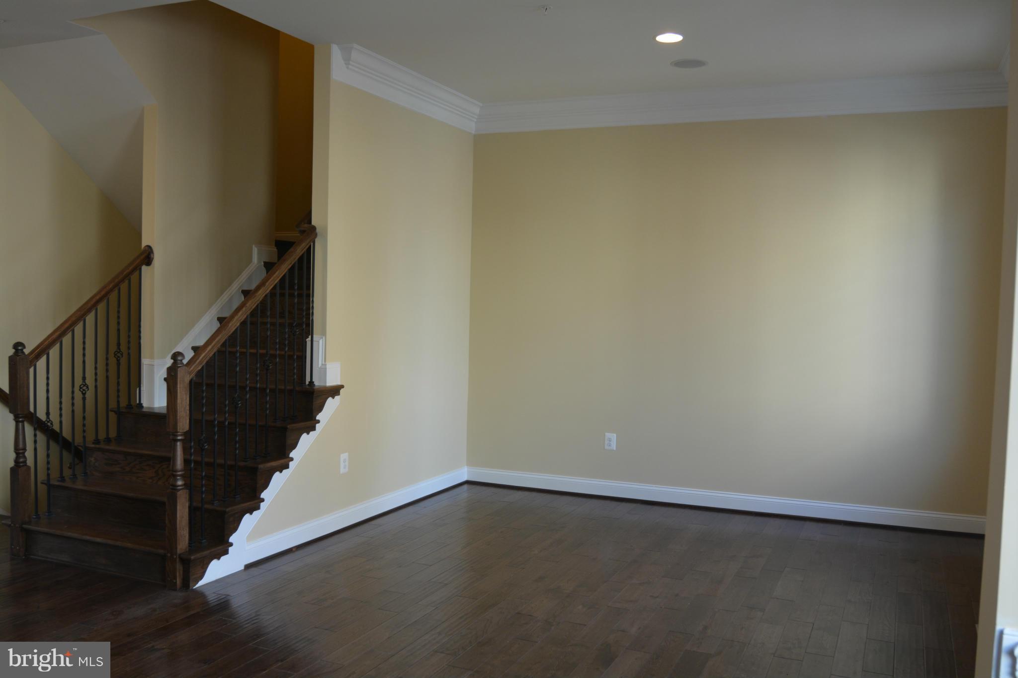 1411 Ridgeview Way Washington, DC 20007 - Photo 7 of 15 a view of an empty room with wooden floor