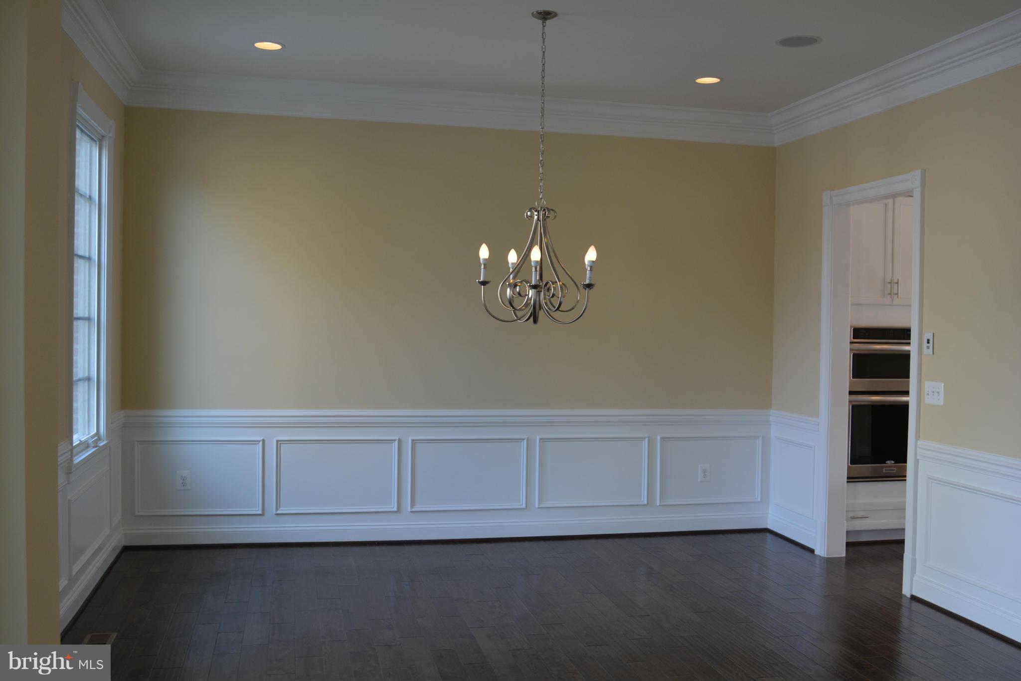 1411 Ridgeview Way Washington, DC 20007 - Photo 8 of 15 wooden floor in an empty room with a window
