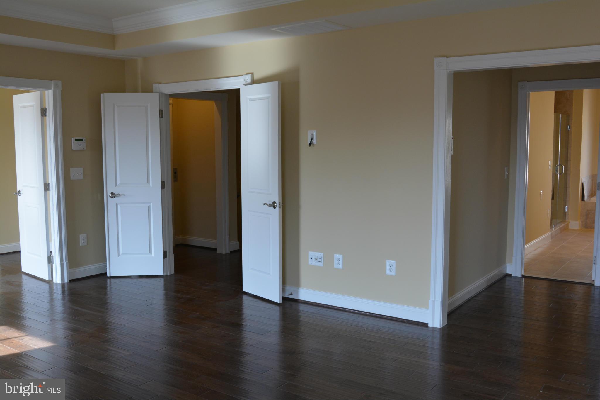 1411 Ridgeview Way Washington, DC 20007 - Photo 9 of 15 an empty room with wooden floor and closet